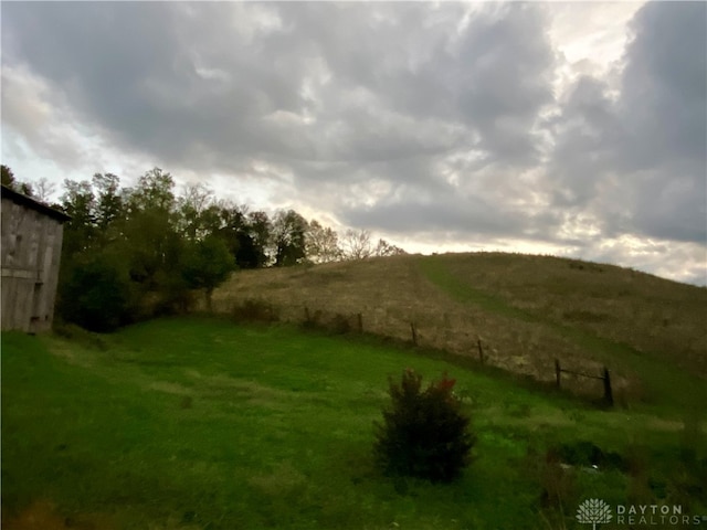 view of yard with a rural view