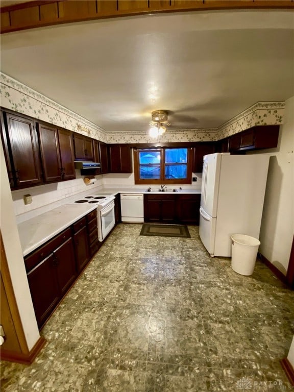 kitchen with ventilation hood, white appliances, sink, and ceiling fan