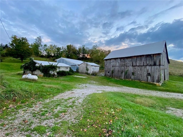 2586 State Route 763, Aberdeen, OH 45101 - view of green lawn featuring a barn and an outbuilding