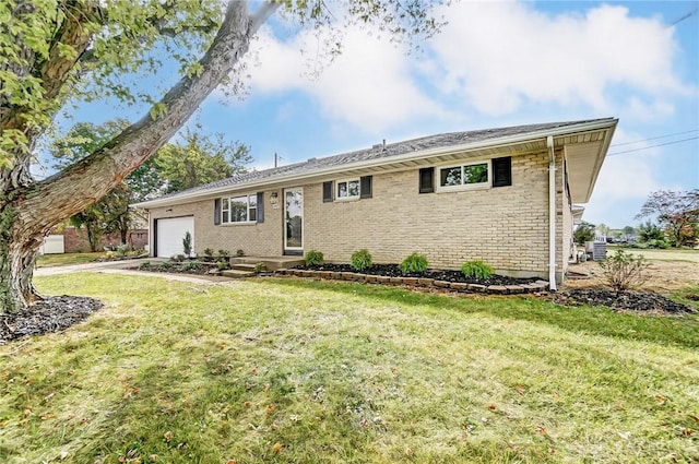 ranch-style house with a garage, a front lawn, and brick siding