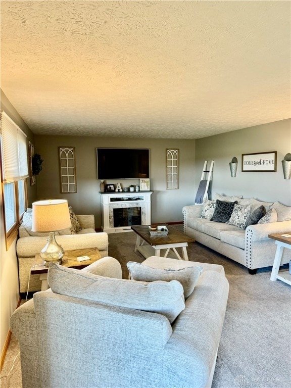 carpeted living room with a textured ceiling