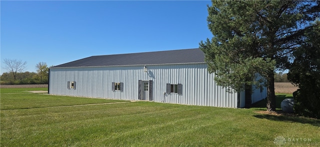 view of outdoor structure with a lawn