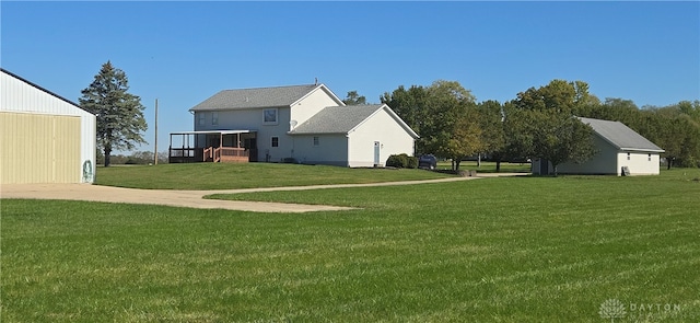 view of yard with an outbuilding and a garage