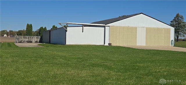 view of outbuilding featuring a lawn