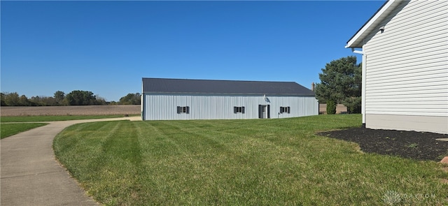 view of side of home featuring a yard