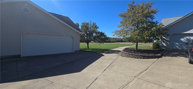 garage featuring a yard