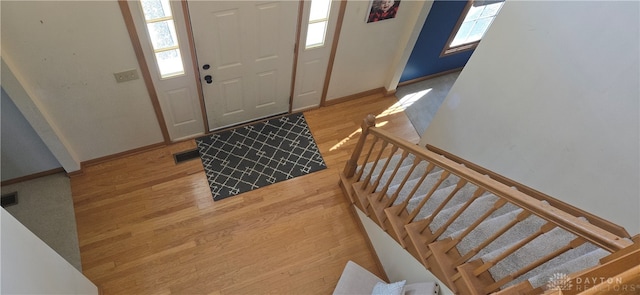 foyer entrance with light hardwood / wood-style flooring