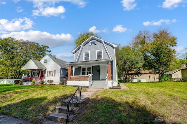 front of property featuring a front yard and covered porch