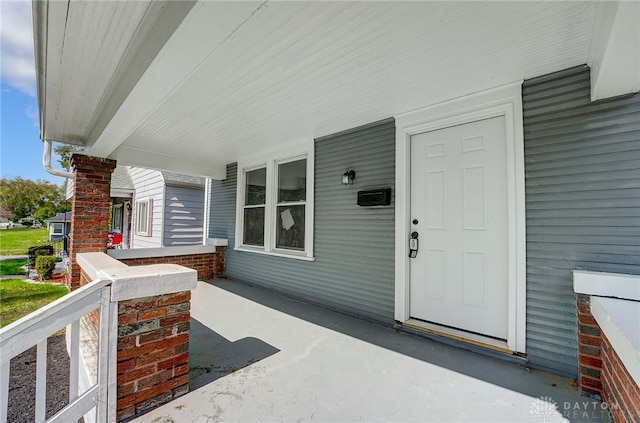 property entrance featuring a porch