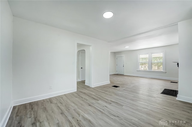 unfurnished room featuring light hardwood / wood-style floors