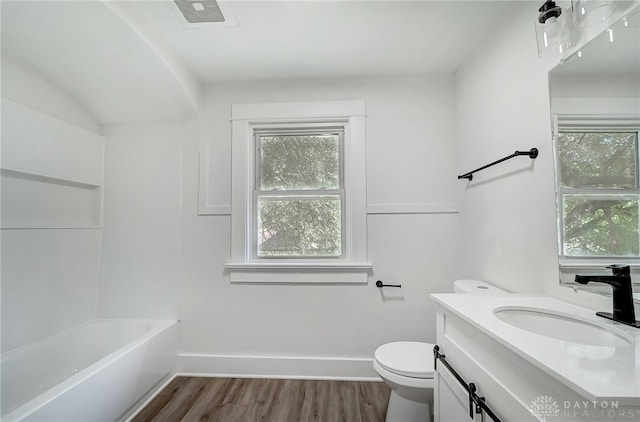 bathroom with vanity, hardwood / wood-style floors, and toilet