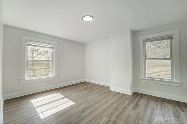 spare room featuring light hardwood / wood-style flooring