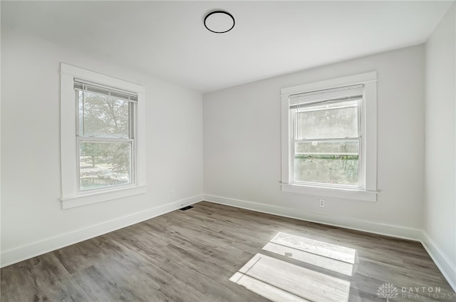 spare room featuring light hardwood / wood-style floors