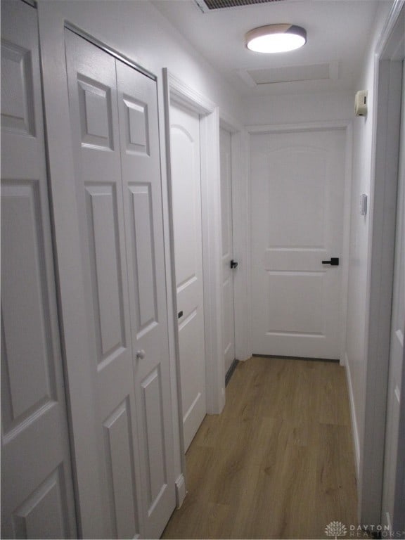 corridor featuring hardwood / wood-style flooring