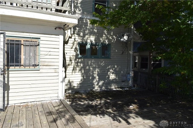 view of home's exterior featuring a wooden deck