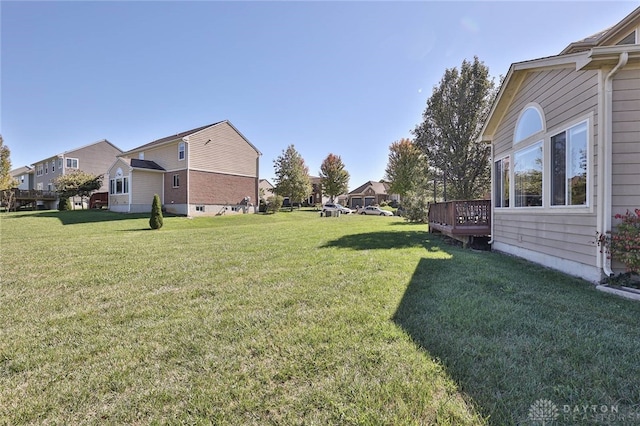 view of yard with a wooden deck