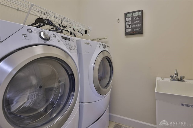 washroom featuring washer and clothes dryer