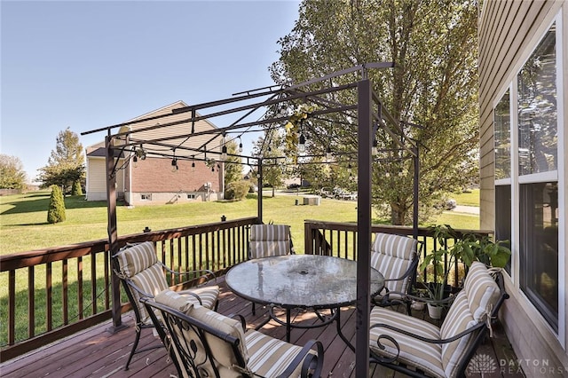 wooden terrace featuring a lawn