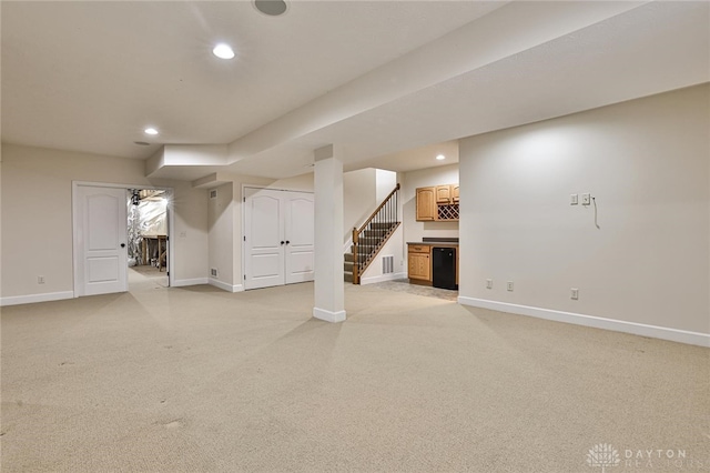 basement featuring light carpet