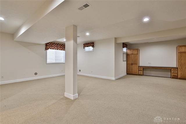 basement with light colored carpet