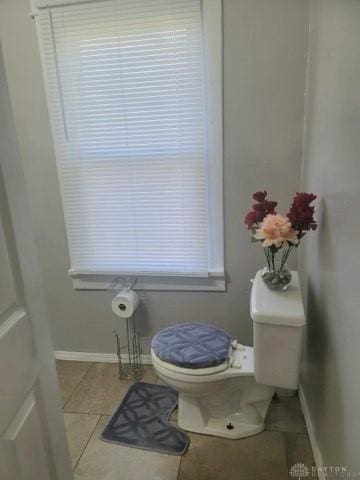 bathroom with tile patterned floors and toilet