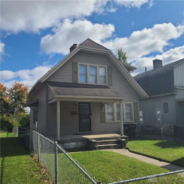 bungalow with a front lawn and a porch