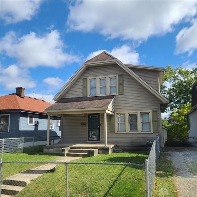 bungalow featuring a front yard and a porch