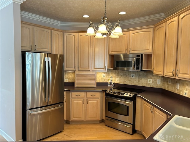 kitchen with stainless steel appliances, light hardwood / wood-style floors, hanging light fixtures, an inviting chandelier, and ornamental molding