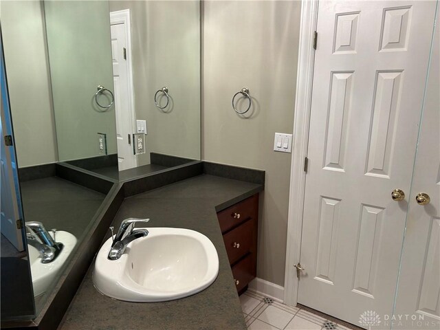 bathroom featuring tile patterned floors and vanity