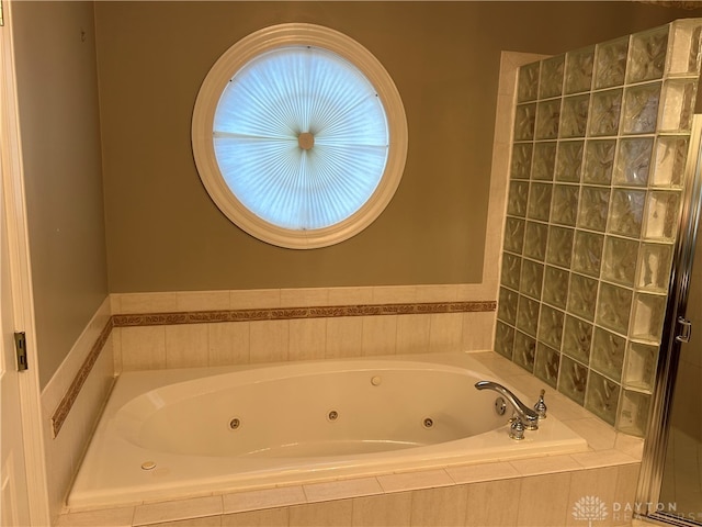 bathroom featuring shower with separate bathtub