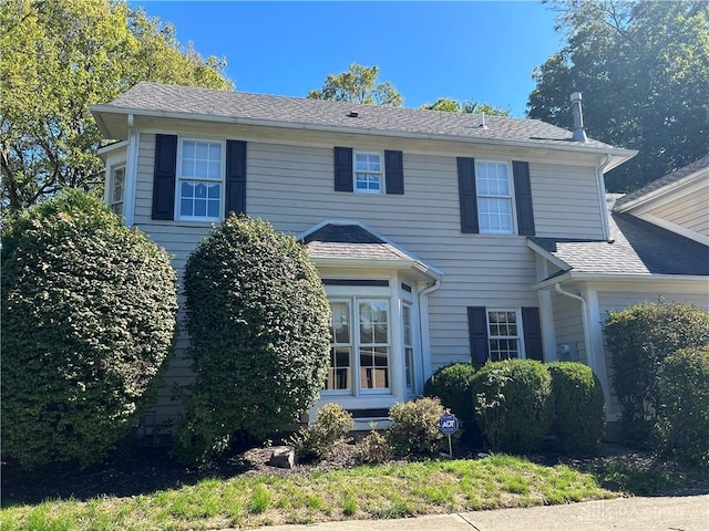 view of front of house featuring roof with shingles