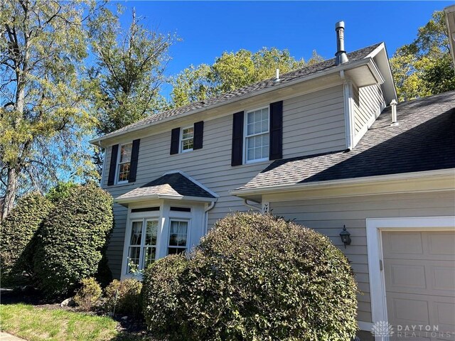 view of property exterior with a garage