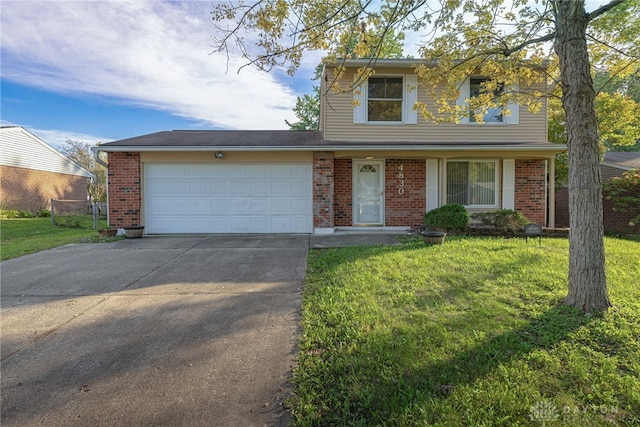 view of front property featuring a garage and a front yard