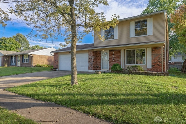 view of front of property with a garage and a front lawn