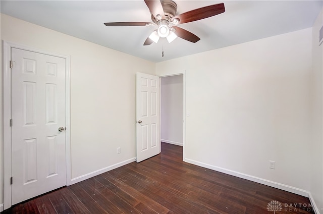 unfurnished bedroom with dark wood-type flooring and ceiling fan