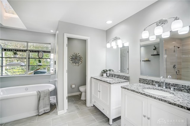 full bathroom with vanity, toilet, tile patterned floors, and independent shower and bath