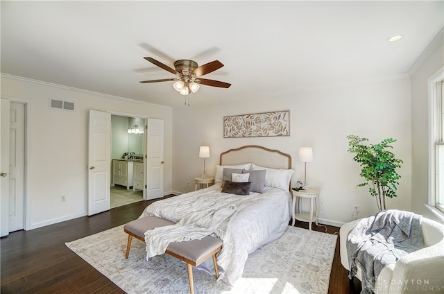 bedroom with ceiling fan, ensuite bath, ornamental molding, and dark hardwood / wood-style floors