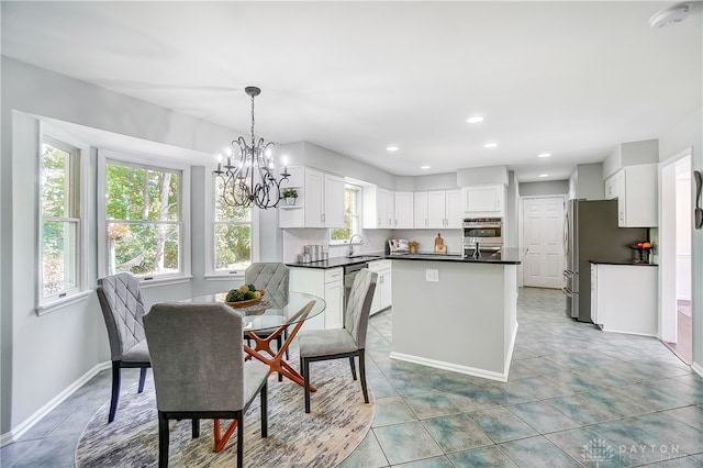 dining room with sink and light tile patterned flooring