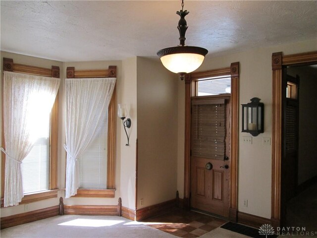 204 N Main St, Lewisburg, OH 45338 - entrance foyer featuring baseboards and a textured ceiling