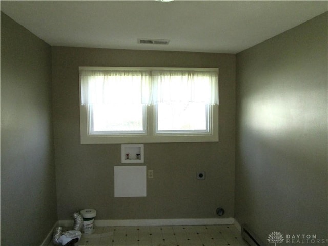 204 N Main St, Lewisburg, OH 45338 - washroom with hookup for an electric dryer, baseboards, washer hookup, and plenty of natural light