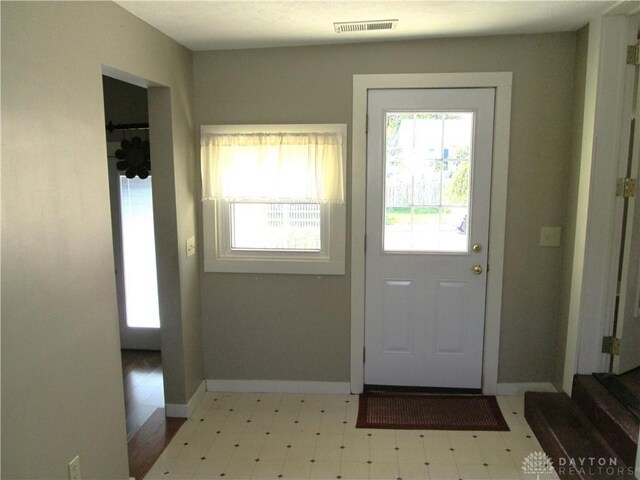 204 N Main St, Lewisburg, OH 45338 - doorway featuring tile patterned floors and baseboards
