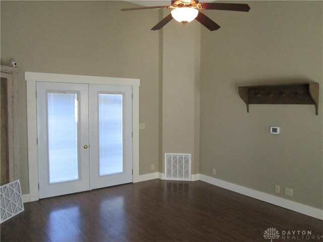 204 N Main St, Lewisburg, OH 45338 - unfurnished room featuring french doors, dark wood-type flooring, ceiling fan, and baseboards