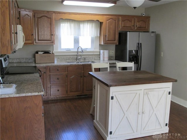 204 N Main St, Lewisburg, OH 45338 - kitchen with a sink, fridge with ice dispenser, range, and dark wood-type flooring