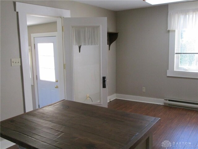 204 N Main St, Lewisburg, OH 45338 - entrance foyer with dark wood-style floors, a baseboard heating unit, and baseboards