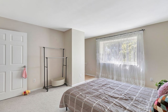 bedroom featuring light colored carpet