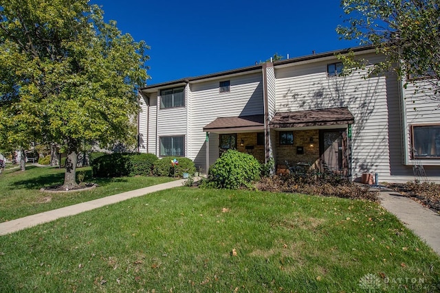 view of front of home with a front lawn