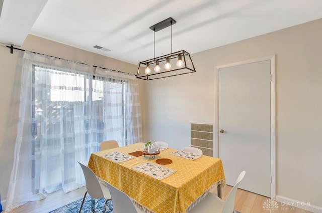 dining room with light wood-type flooring