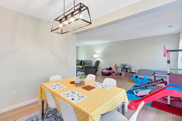 dining area featuring wood-type flooring