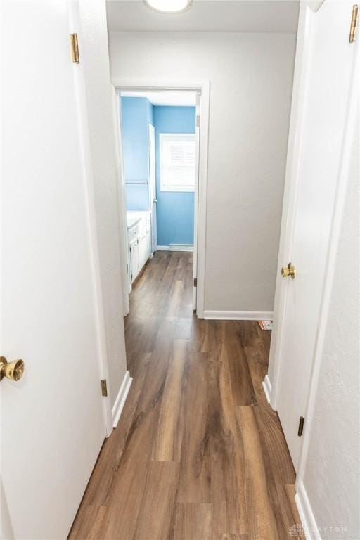 hallway featuring dark hardwood / wood-style floors