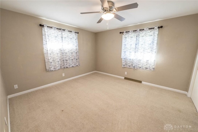 carpeted empty room with ceiling fan